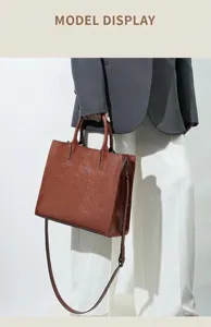 Stylish brown leather tote bag for women, large capacity shoulder handbag for commuting.
