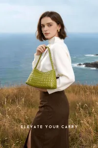 Green woven leather hobo shoulder bag detail showcasing premium craftsmanship and elegant style.