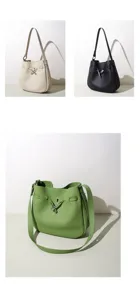 Bolso cubo de cuero genuino para mujer, elegante bolso cruzado con cierre de metal sofisticado.