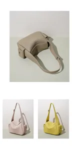 Sac à bandoulière minimaliste en cuir véritable, élégant sac yuanbao tendance pour femmes.