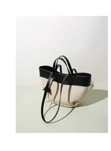 Two-tone canvas and leather tote bag, casual daily shoulder handbag with dual handles.