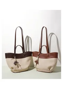 Detail shot of retro contrast color tote bag, PU leather and linen material, double straps.