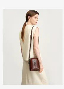 Genuine leather small crossbody phone bag for women, stylish brown vertical shoulder bag daily use.