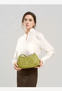 Green woven leather shoulder bag, stylish underarm handbag for women, chic daily commute accessory.