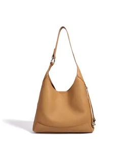 Sac hobo épaule en cuir marron caramel avec anneau en métal et pompon latéral élégant.