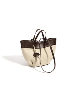 Retro color-block canvas and leather tote bag with large capacity, shoulder and handbag style.
