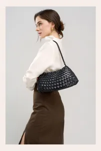 Black woven leather shoulder bag for women, chic commuting designer style handbag.