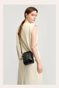 Black genuine leather phone crossbody bag, stylish mini shoulder bag for women daily wear.