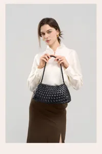 Chic black woven leather shoulder bag for women, elegant underarm daily commuting tote.