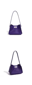 Detail shot of purple pebbled leather shoulder bag featuring silver-tone metal turn-lock closure.
