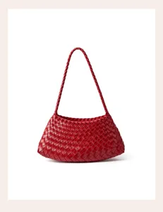 Close-up detail of a luxury red woven leather handbag showing exquisite craftsmanship and texture.