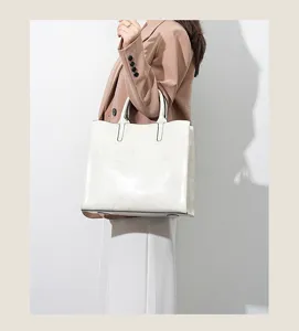 Minimalist white women tote bag detail, elegant leather texture for daily commute use.