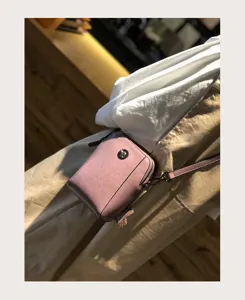 Waxy cowhide small crossbody bag for women, stylish casual leather phone bag with metal flower decor.