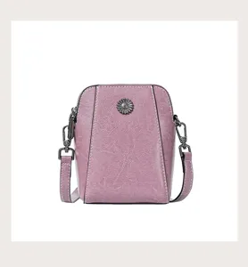 Detailed view of women's leather crossbody phone bag, oil wax texture, pink metal flower.
