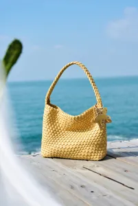 Yellow woven shoulder bag for beach vacation, stylish casual large capacity bucket tote.