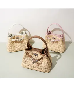 Straw woven handbag with leather trim, stylish turn-lock closure and top handle design.