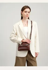 Detail view of the vintage genuine leather women crossbody bag showing premium texture.