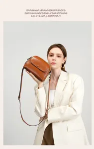 Detailed view of women genuine leather shoulder crossbody bag in retro brown with flap closure.