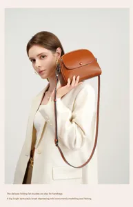 Women genuine leather vintage shoulder crossbody bag stylish brown round bag for daily wear.