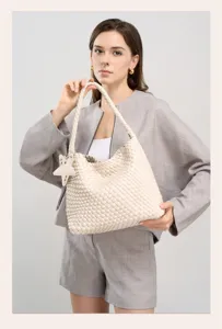 Chic beige woven leather shoulder bag detail, elegant hobo tote handbag with star charm.