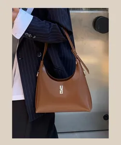 Brown leather underarm shoulder bag detail, stylish niche design handbag for women.