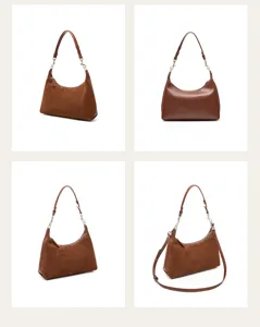 Suede leather hobo shoulder bag detail, elegant crescent shape with metal hardware links.