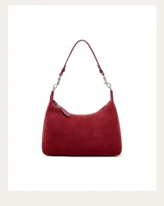 Detailed view of dark red suede underarm shoulder bag with smooth zipper and metal hardware.