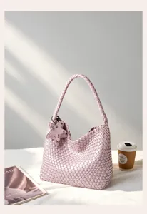 Pink woven shoulder bag for women, stylish leather hobo tote handbag with cute star charm.