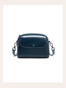 Detailed view of the dark blue leather retro crossbody bag, showing fine stitching and hardware.