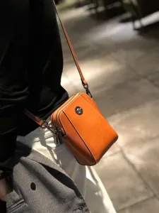 Genuine leather oil-wax cowhide mini crossbody phone bag for women, stylish brown casual daily use.