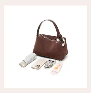 Brown suede shoulder bag for women, stylish geometric design handbag with large capacity.