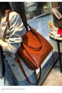 Elegante bolso de hombro de cuero genuino para mujer, bolso saco marrón de gran capacidad.