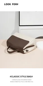 Detail shot of the two-tone leather shoulder handbag showing exquisite craftsmanship and stitching.
