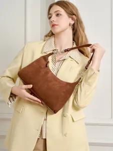 Elegant brown suede shoulder bag for women, chic hobo crossbody purse with leather strap.
