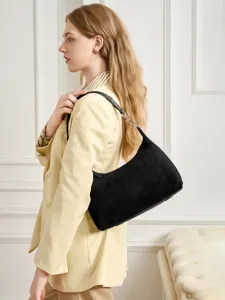Stylish black suede shoulder bag for women, elegant hobo handbag for daily commute and casual use.