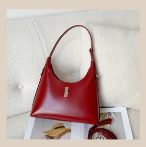 Classic red leather hobo shoulder bag with metal lock, stylish and versatile daily handbag.