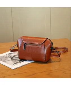 Premium leather shell crossbody bag for women, stylish brown casual shoulder bag with metal zippers.