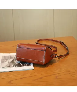 Brown oil wax leather women's shoulder crossbody shell bag, casual fashion handbag detail view.