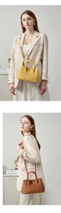 Elegante bolso de cubo de cuero genuino para mujer, diseño elegante para uso diario.
