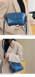 Detail view of women blue leather crossbody bag, soft oil wax cowhide, casual shell purse.