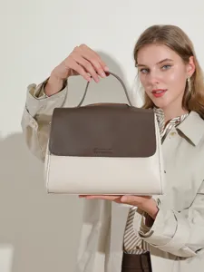 Two-tone leather handbag for women, spacious casual commuter shoulder bag with top handle.
