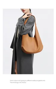 Detail view of the brown leather hobo shoulder bag, showing large capacity and daily commute style.