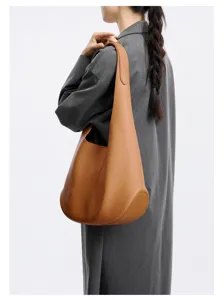 Cowhide leather hobo shoulder bag detail, showcasing premium textured leather design.
