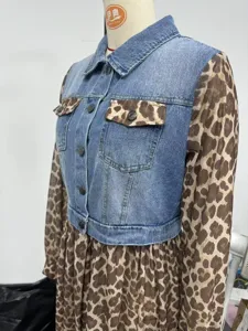 Detail of denim bodice and leopard print sleeves on a stylish patchwork women's dress.