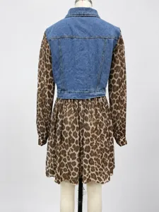 Back view of a trendy denim and leopard print patchwork mini dress on a mannequin stand