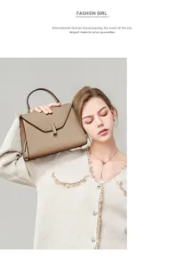 Detail view of the premium leather handbag, featuring an elegant trapezoid shape and top handle.