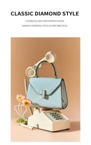 Elegant light blue leather top handle bag, exquisite geometric clasp design for daily commute.