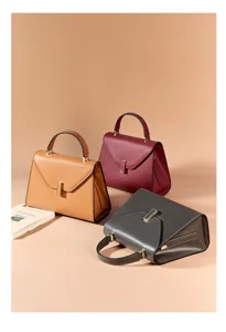 Elegant leather top-handle shoulder bag with structured design and large capacity.