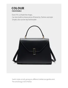 Detailed view of stylish black genuine leather top-handle shoulder bag with metal closure