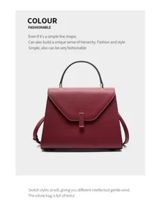 Elegant wine red leather handbag with top handle and shoulder strap for women daily work.